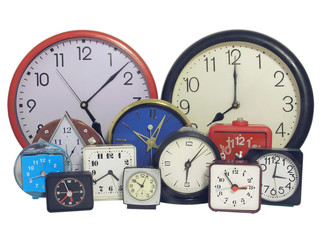 Several  clock faces of different sizes and styles