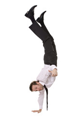 Businessman doing handstand and giving a thumbs up