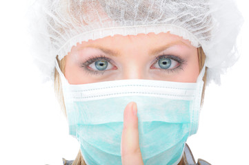 Female doctor/nurse with mask asking for silence - 16274642