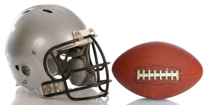 protective football helmet and leather football with reflection