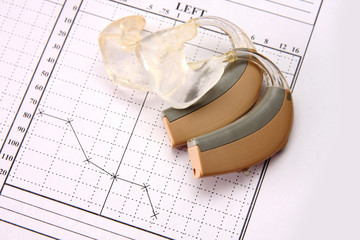 medical chart and hearing aid