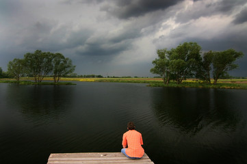 Solitude man at the lake