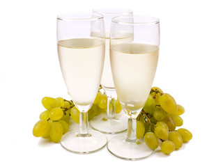 Glasses with white wine and white grape