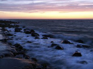 coastline of misty rocks at twilight