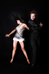 dancers against black background