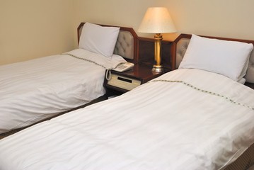 Fototapeta na wymiar Twin beds in hotel
