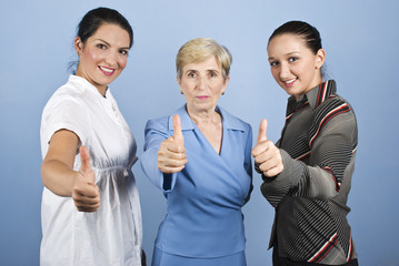 Fototapeta na wymiar Successful business women giving thumbs up