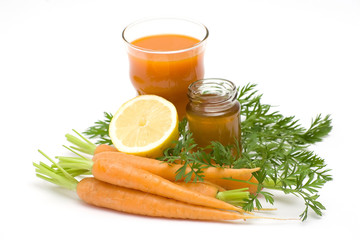 glass of fresh juice, carrots, honey and lemon