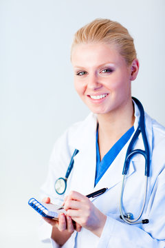 Female Doctor Writing A Perscription