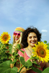 Two beautiful girls in sunflower