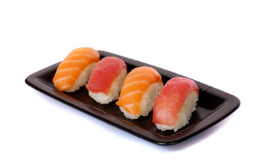 Salmon and tuna sushi on a plate isolated on white