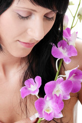 Beautiful Caucasian woman and orchid