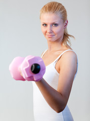 Beautiful woman trained with weights focus on woman