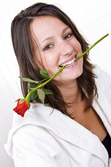 Woman biting rose