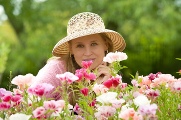 Young woman enjoys working in the garden