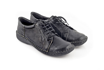 Pair of modern leather women's shoes over white