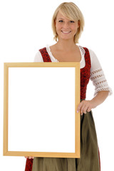 Junge Frau im Dirndl mit Schild