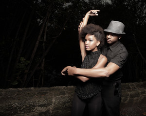 Man showing the woman how to dance