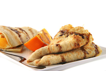 two pancakes on porcelan dish