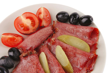 sliced served sausage with salted cucumber