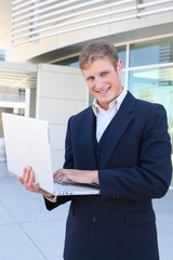 Business Man at Office with Laptop