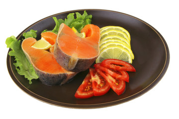 two salmon steak on dark dish