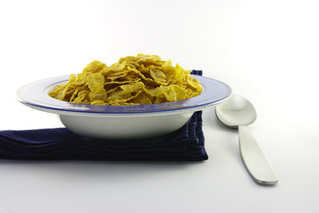 Cornflakes in a Blue Bowl with a Spoon