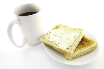 Fototapeta na wymiar Toast on a White Plate with Coffee