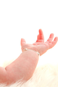 Open baby's hand on white background