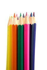 colored pencils over white background