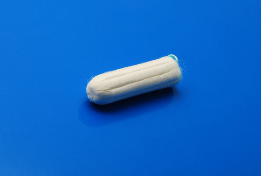tampon over blue background