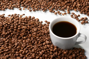 Cup with coffee, costing on coffee grain