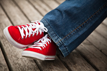 Red sneakers and jeans