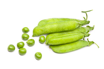 Pods of fresh green peas on a white background