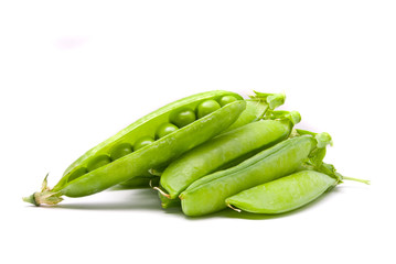 Pods of fresh green peas on a white background