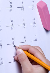 Solving basic subtraction problems. © Gregory Johnston
