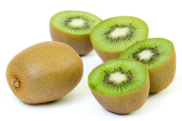 Freshly harvested kiwi fruit on white background