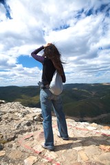 Naklejka premium woman at the top of the landscape