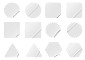Set of blank white stickers isolated on white background.