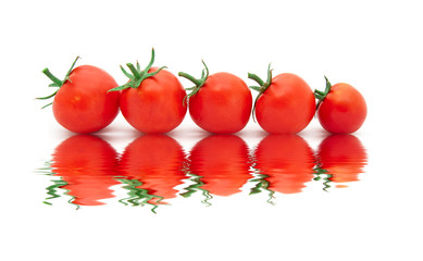 beautiful ripe tomatoes with reflexion in water