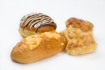 Cake from the layred paste, donut and  roll with cheese.