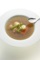 soup with organic vegetables and a spoon