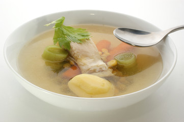 carp fish soup with fresh organic herbs