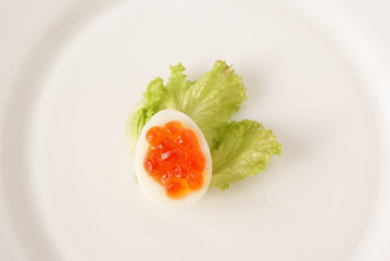 Snack of the quail eggs and caviar