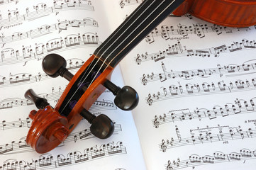 Violin scroll on music manuscript