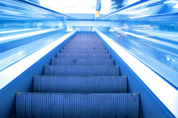 fast blue moving escalator