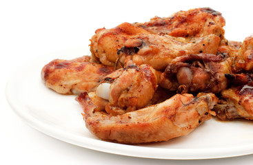 Grilled chiken legs on plate