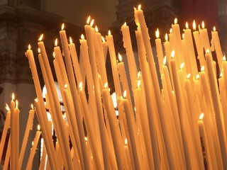 Burning candles in cathedral in Venice