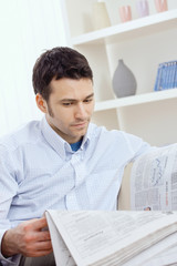 Man reading newspaper