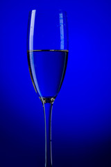 champagne glasses on blue background macro